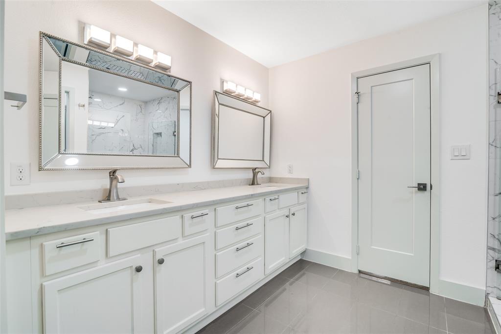 8722 Angora Street Dallas, TX 75218 - Photo 19 of 26 a bathroom with double sink and a mirror