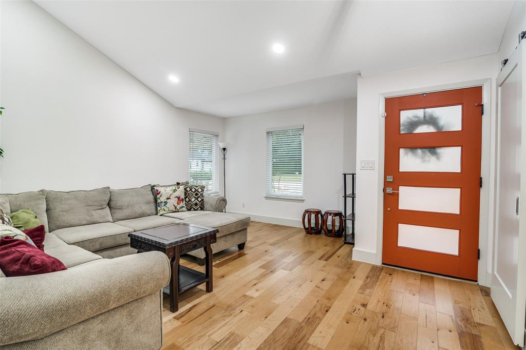 8722 Angora Street Dallas, TX 75218 - Photo 4 of 26 a living room with furniture and a wooden floor