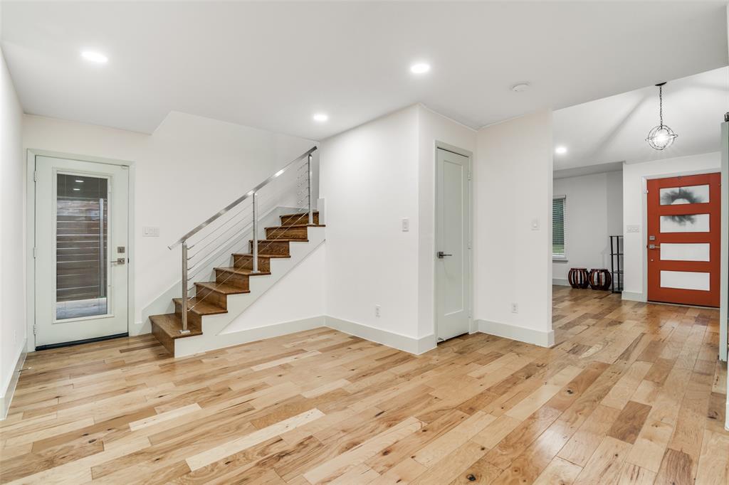 8722 Angora Street Dallas, TX 75218 - Photo 5 of 26 a view of entryway with stairs and wooden floor