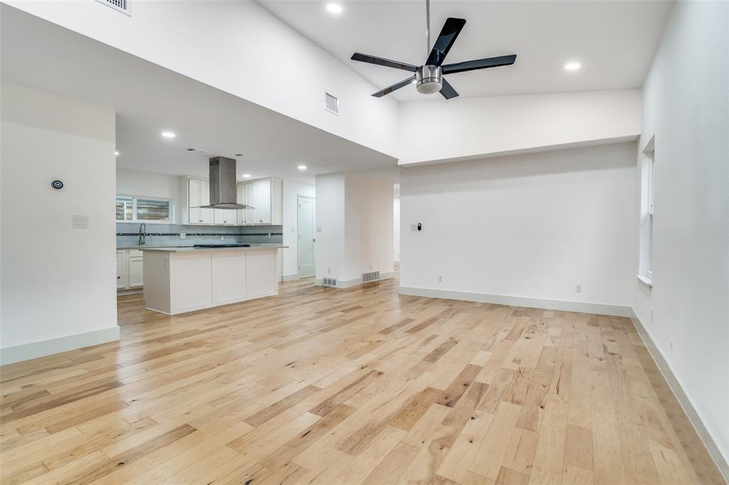 8722 Angora Street Dallas, TX 75218 - Photo 9 of 26 a view of a kitchen with a sink stainless steel appliances and cabinets