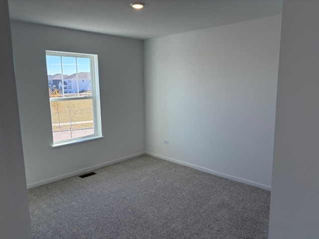 102 Ellis Road Algonquin, IL 60102 - Photo 5 of 45 an empty room with a window