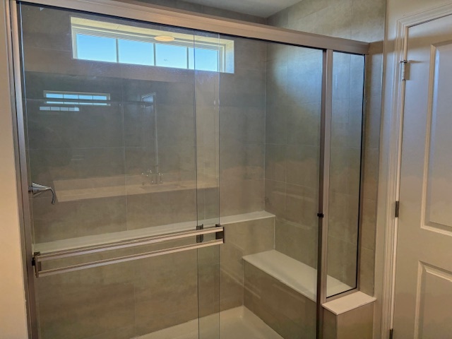 102 Ellis Road Algonquin, IL 60102 - Photo 7 of 45 a bathroom with a glass shower door