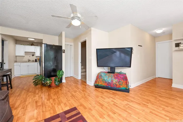 a bedroom with a bed next to a window