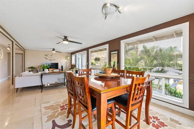 a kitchen with stainless steel appliances granite countertop a refrigerator a stove and a sink