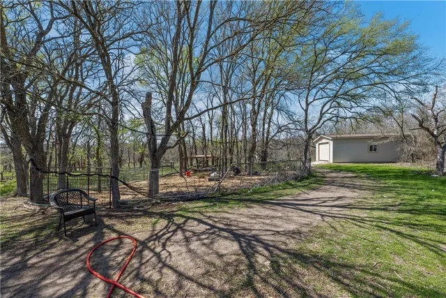 a backyard of a house with lots of green space
