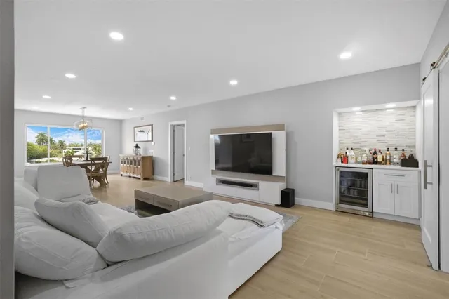 a bathroom with a shower sink and mirror