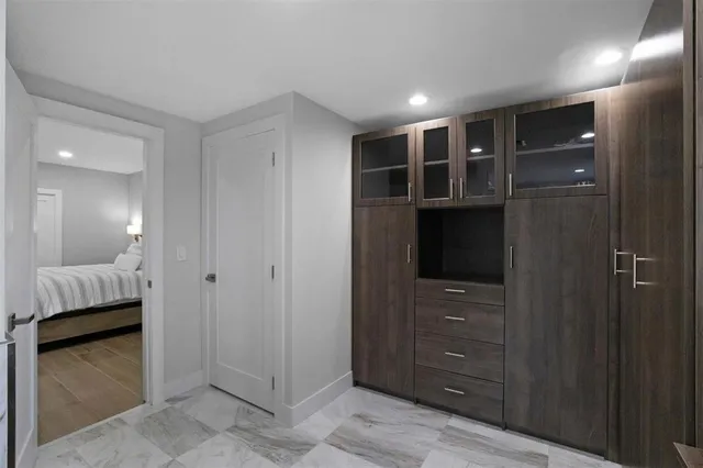 a living room with furniture rug and a window