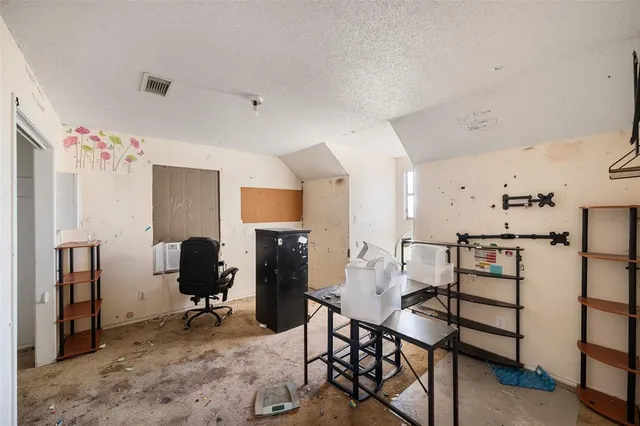 a view of a workspace with furniture