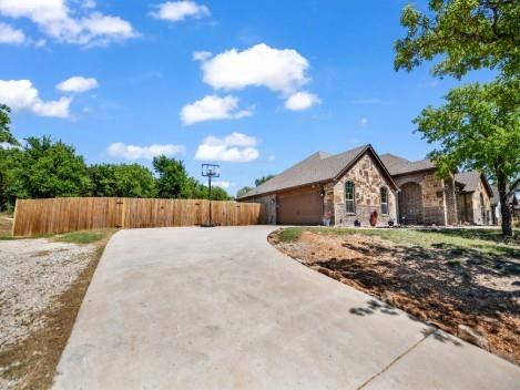 156 Cottongame Road Weatherford, TX 76088 - Photo 33 of 35 a front view of a house with a yard and trees