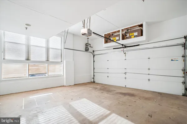 a view of a room that has a bed and a window
