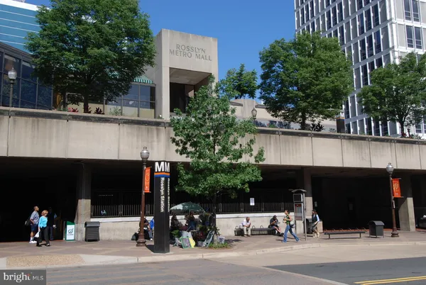 a front view of a building with sign board