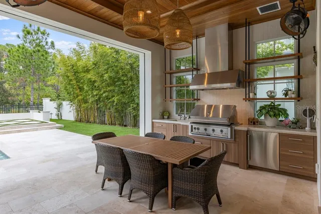 a view of a yard with table and chairs