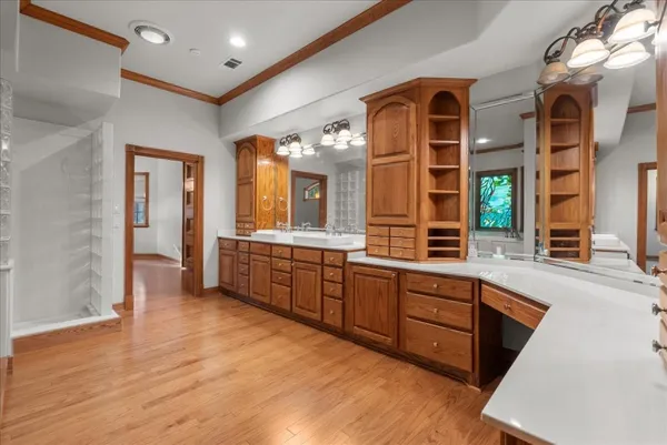 a large kitchen with granite countertop a large counter top and sink