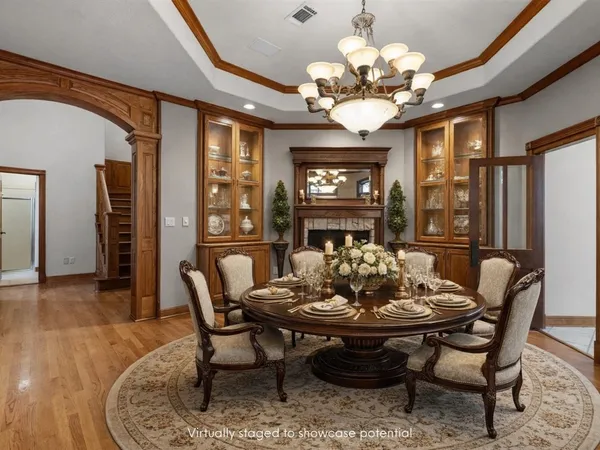 a dining room with furniture a rug and a large window