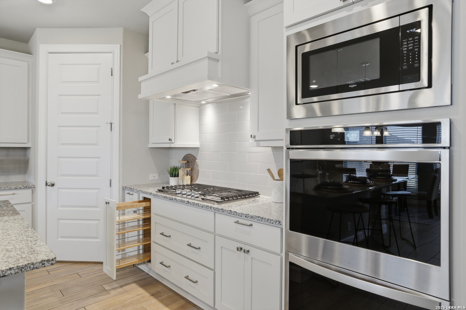 337 Misty Sails Cibolo, TX 78108 - Photo 11 of 50 a kitchen with stainless steel appliances white cabinets and stove