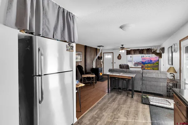 a kitchen with refrigerator and cabinets