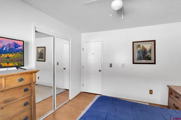 a bedroom with bed and a window