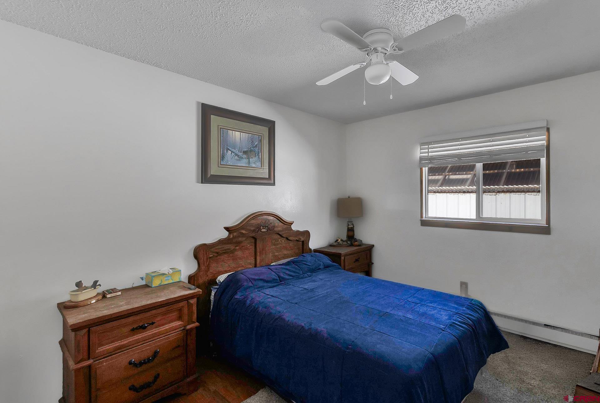 1011 Ray Avenue Delta, CO 81416 - Photo 15 of 26 a bedroom with bed and a window