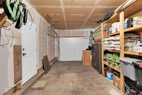 a view of a house with a wooden fence