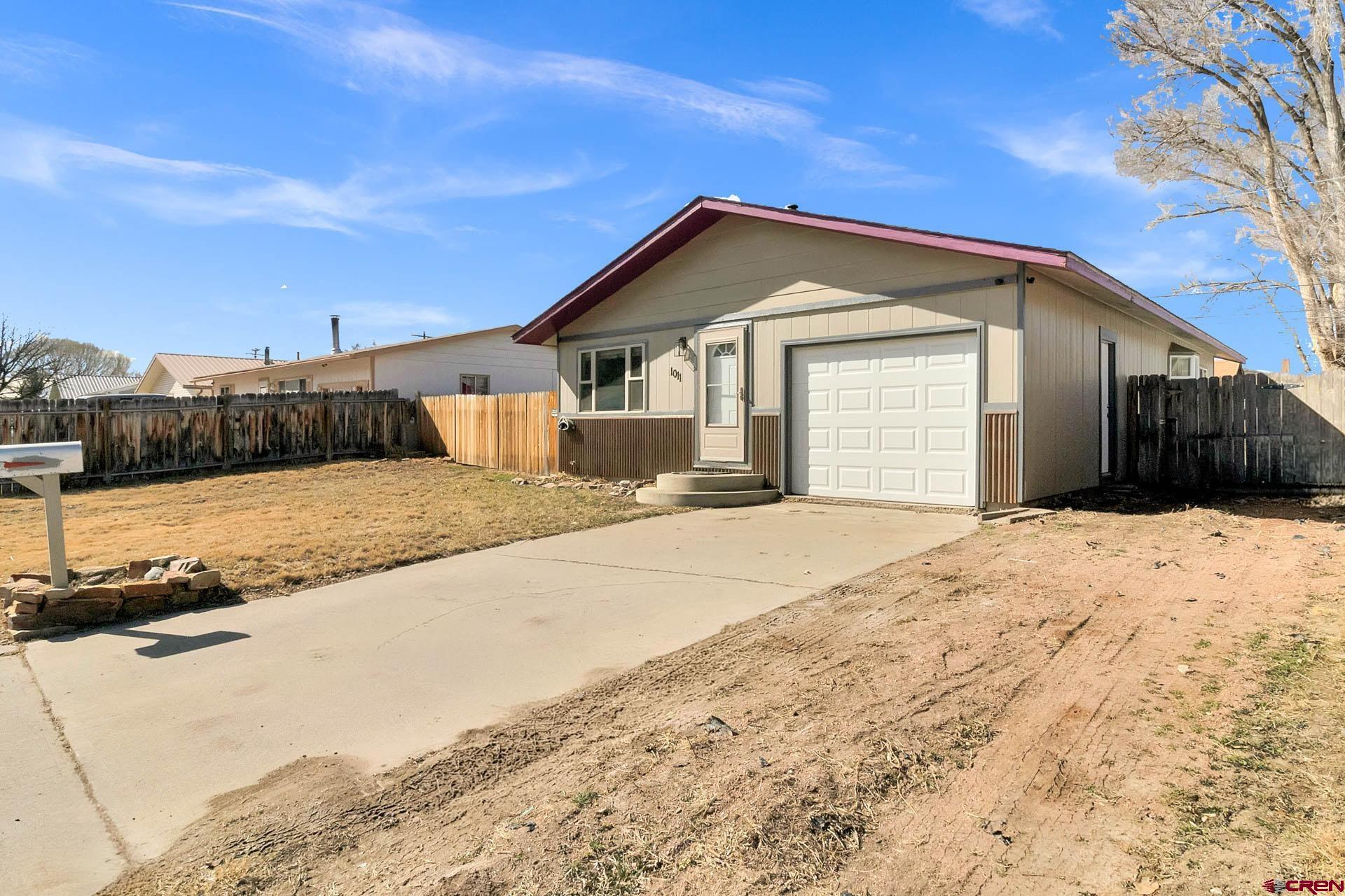 1011 Ray Avenue Delta, CO 81416 - Photo 4 of 26 a view of a house with a yard