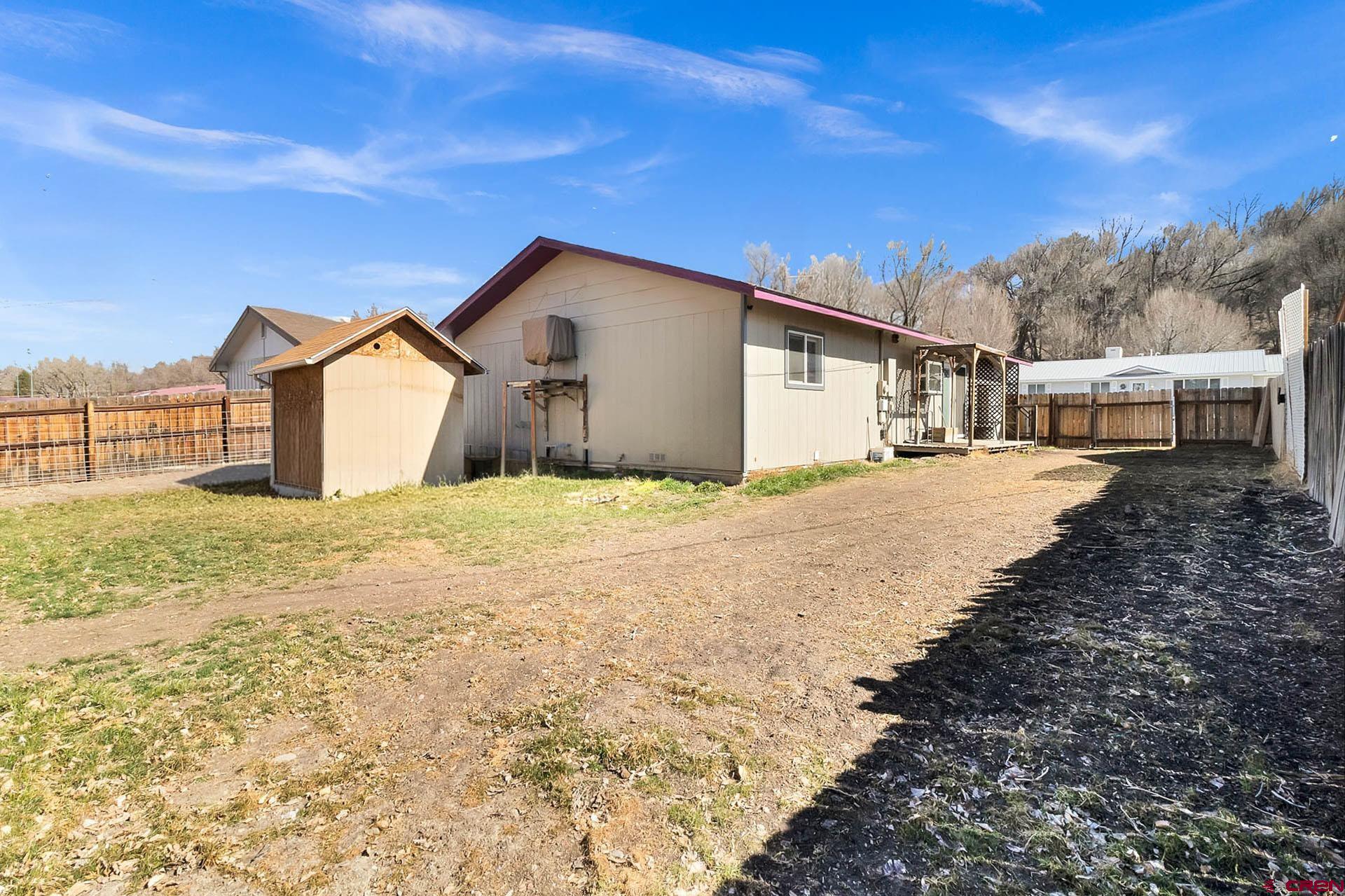 1011 Ray Avenue Delta, CO 81416 - Photo 5 of 26 a view of a house with a yard