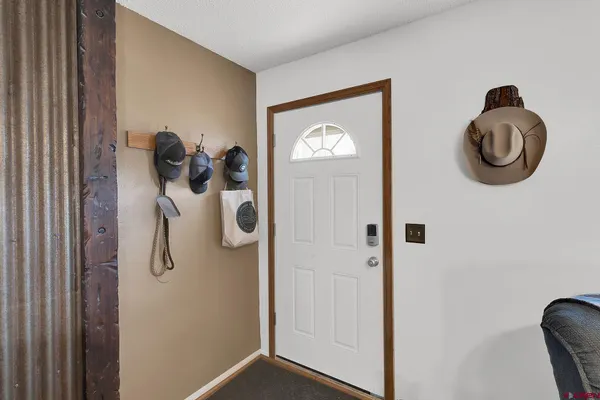 a view of entryway with wooden floor