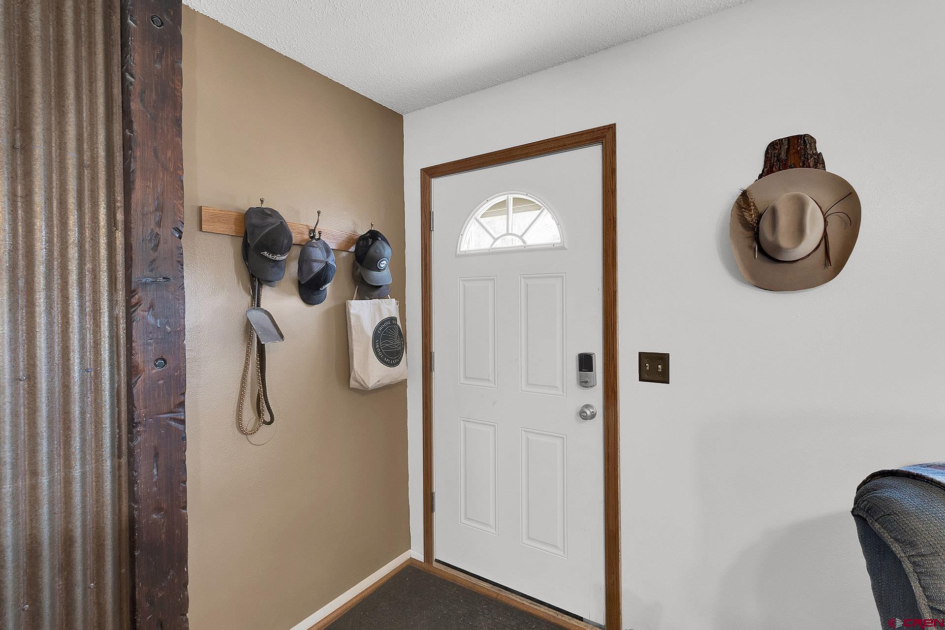 1011 Ray Avenue Delta, CO 81416 - Photo 6 of 26 a view of entryway with wooden floor