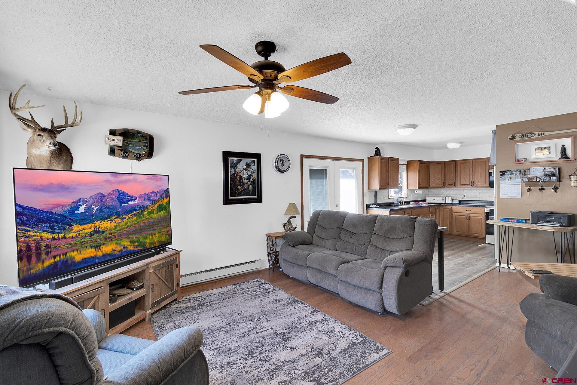 1011 Ray Avenue Delta, CO 81416 - Photo 8 of 26 a living room with furniture and a flat screen tv