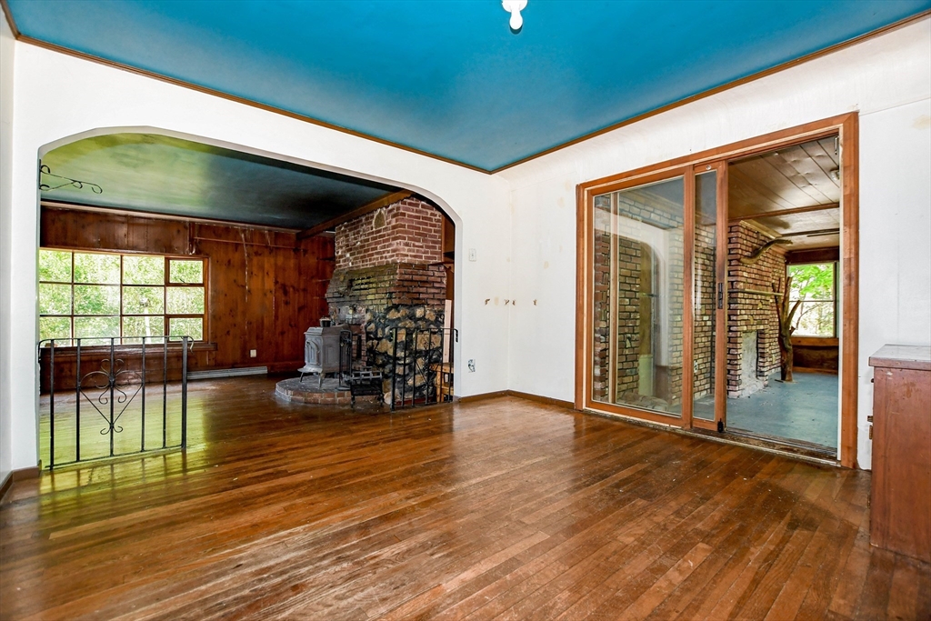 6 Gilbert Way Wareham, MA 02571 - Photo 11 of 41 an empty room with wooden floor and outdoor view