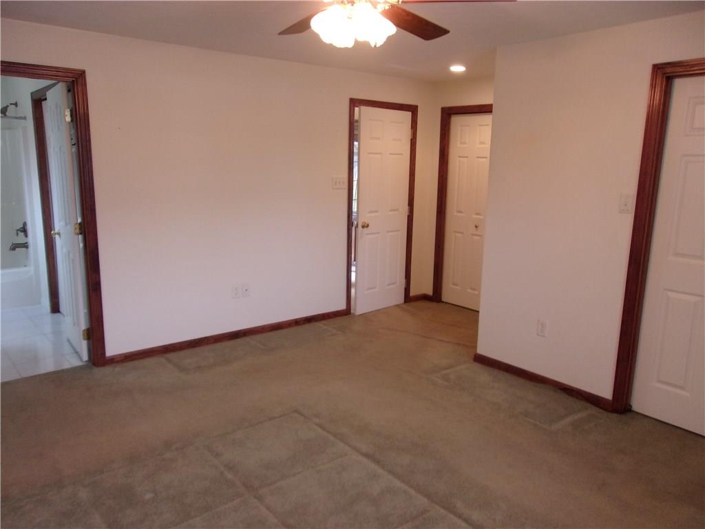 2288 Reis Run Road Pittsburgh, PA 15237 - Photo 14 of 23 Master bedroom suite..door at far right is walk in closet, door in middle is another closet with shelving, door at top of picture is entry to bedroom and full bathroom shown to left in picture.