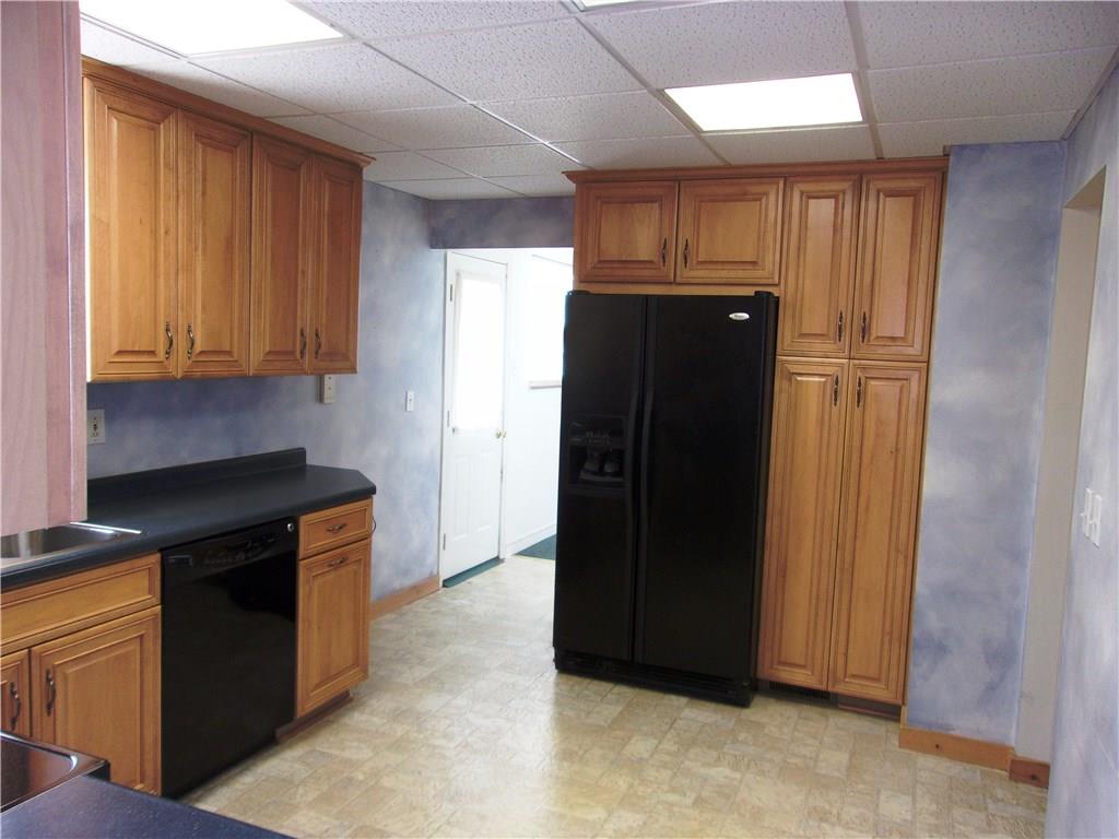 2288 Reis Run Road Pittsburgh, PA 15237 - Photo 10 of 23 View into kitchen from sitting room/den. Entrance to family room shown to left of refrigerator.