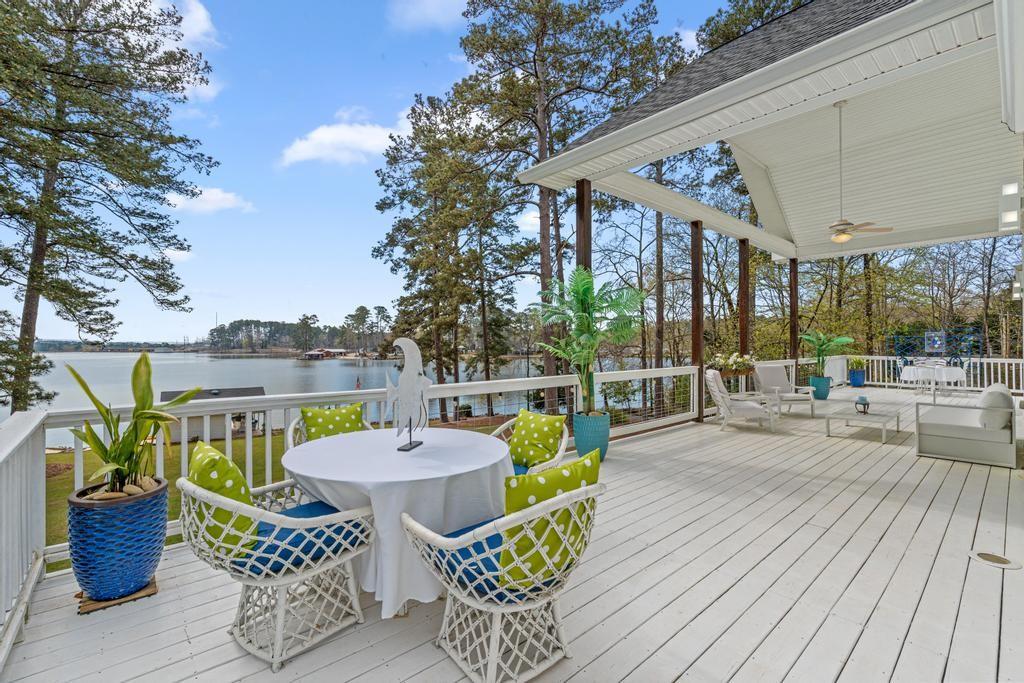 263 Old Hardy Farm Road Jackson, GA 30233 - Photo 26 of 29 a view of a chairs and table in patio with a potted plant