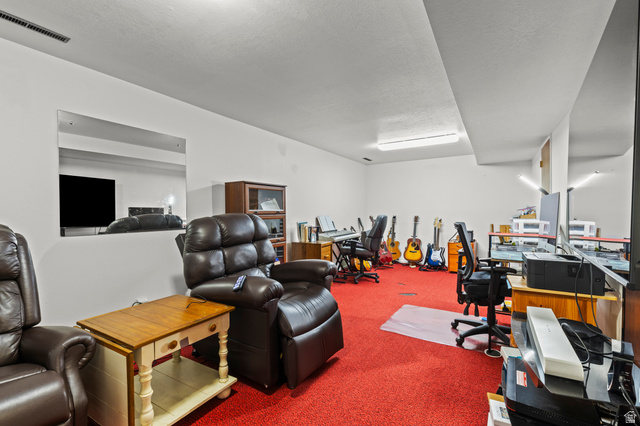 320 North 150 West Logan, UT 84321 - Photo 13 of 22 Miscellaneous room with carpet flooring and a textured ceiling