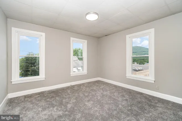 an empty room with windows