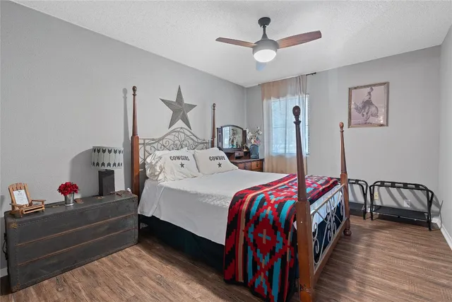 a bed room with bed and a chandelier