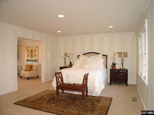 931 La Reno, NV 89509 - Photo 7 of 9 a bedroom with a bed and wooden floor