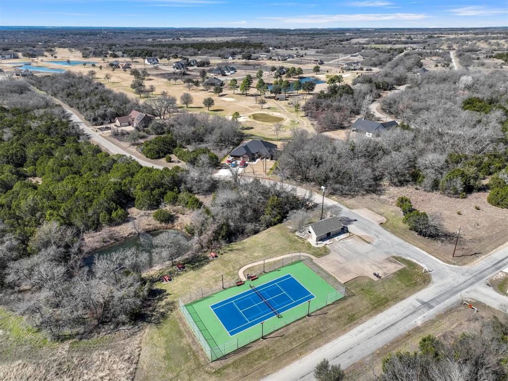 38107 Misty Ridge Drive Whitney, TX 76692 - Photo 1 of 8 an aerial view of residential houses with outdoor space