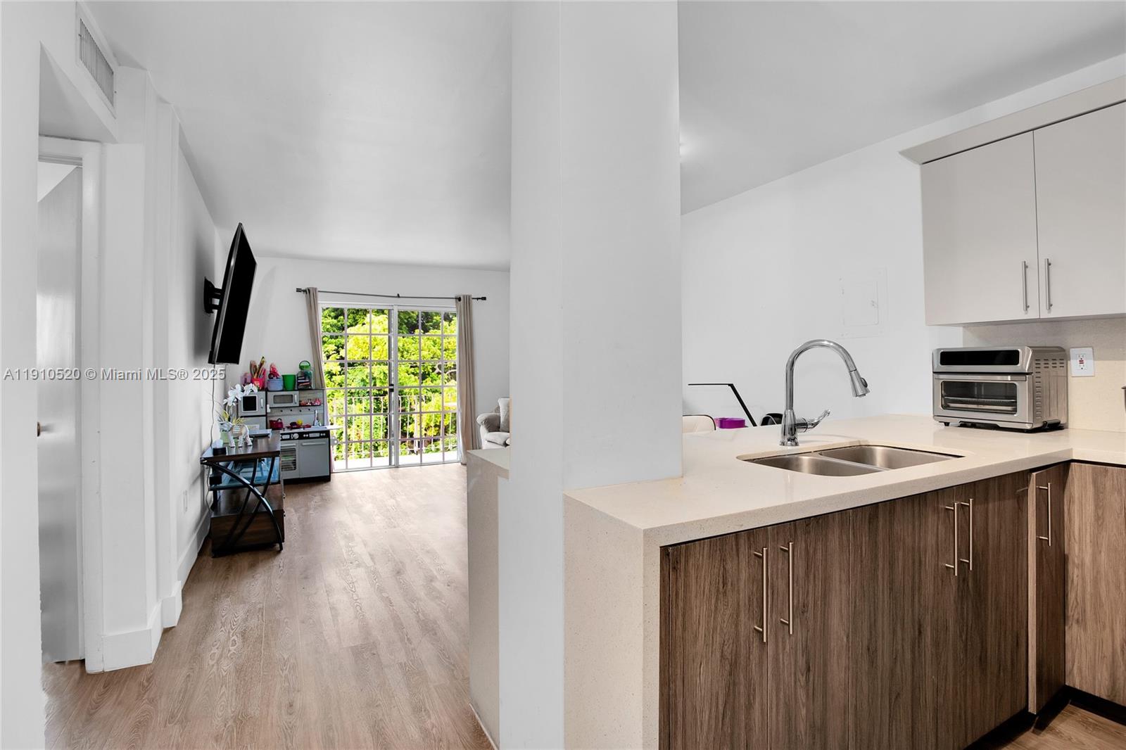 a kitchen with sink refrigerator and stove