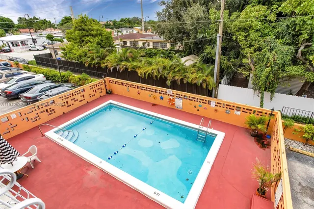 a view of a pool with a patio