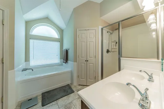 a bathroom with a sink double vanity and a mirror