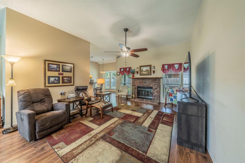 1013 Short Line Boulevard Midlothian, TX 76065 - Photo 2 of 26 a living room with furniture and a fireplace
