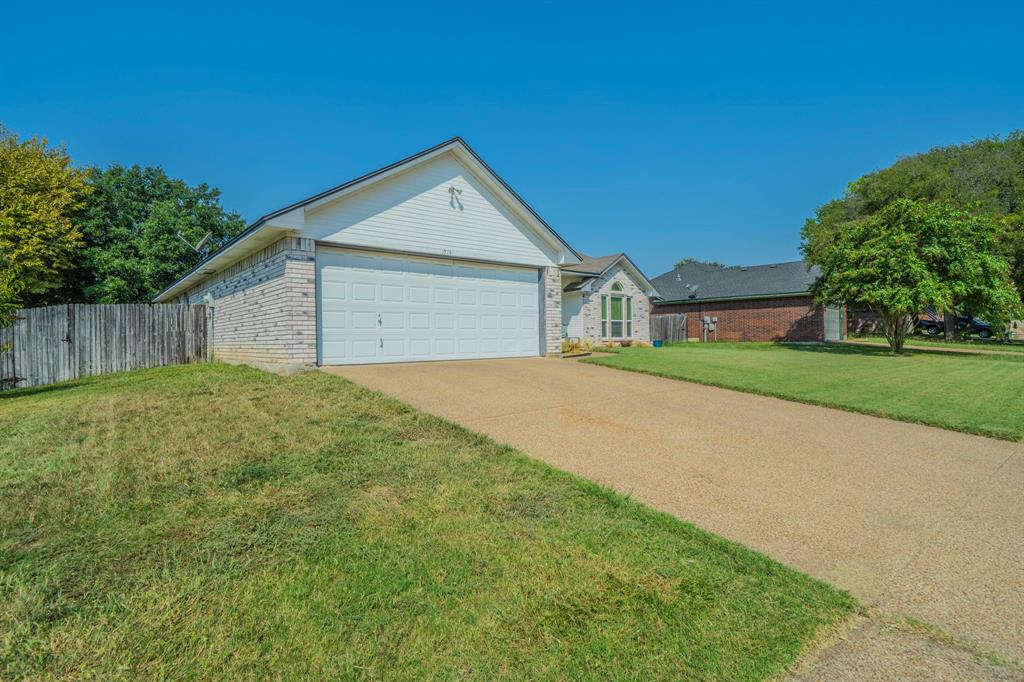1013 Short Line Boulevard Midlothian, TX 76065 - Photo 20 of 26 a view of a house with a yard and garage