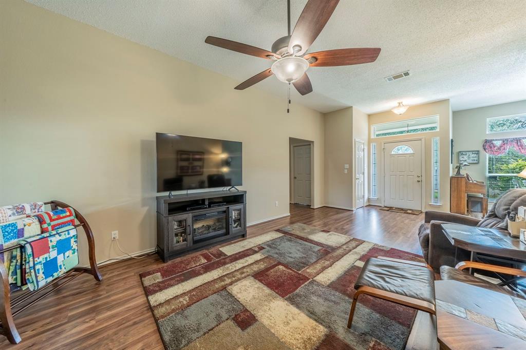 1013 Short Line Boulevard Midlothian, TX 76065 - Photo 4 of 26 a living room with furniture and a flat screen tv
