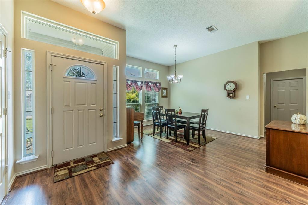 1013 Short Line Boulevard Midlothian, TX 76065 - Photo 8 of 26 a view of a dining room with furniture window and wooden floor