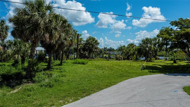 an aerial view of a house with a lake view