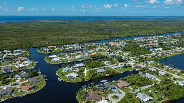 a view of a lake with boats and a wooden floor
