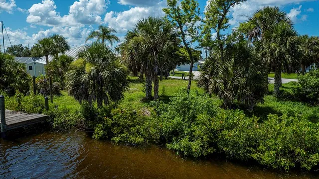a view of a lake with a building in the background