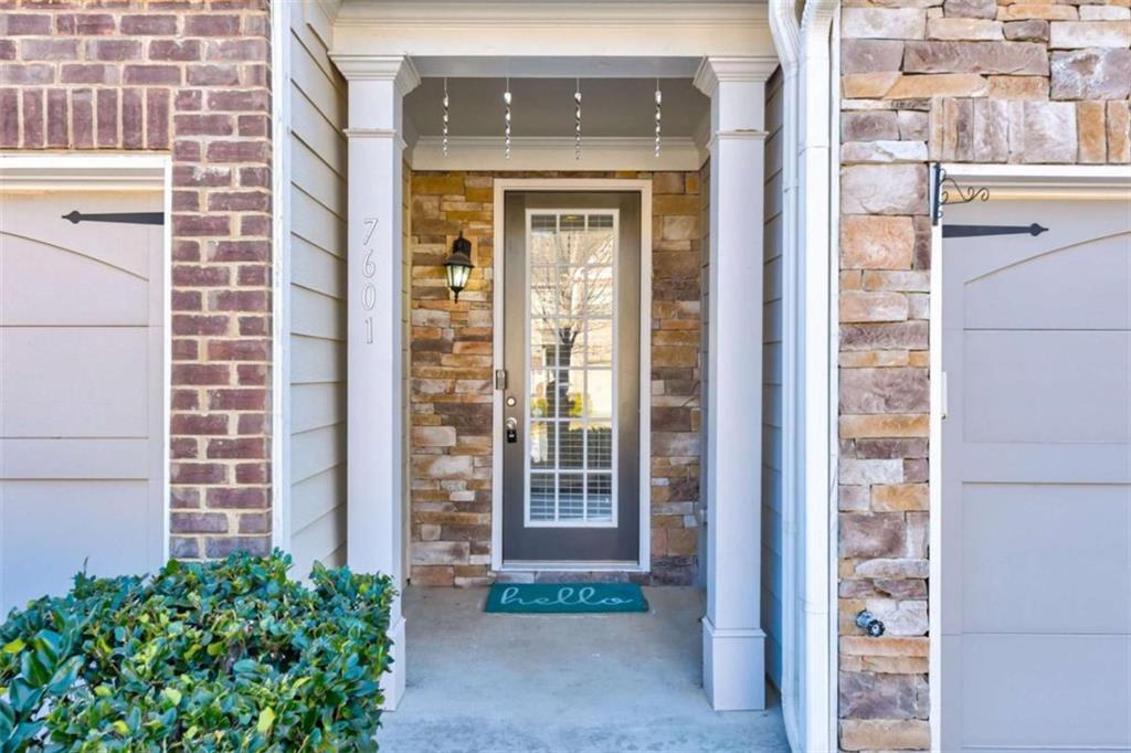 7601 Summer Berry Lane Lithonia, GA 30038 - Photo 2 of 34 a front view of a house with a garden