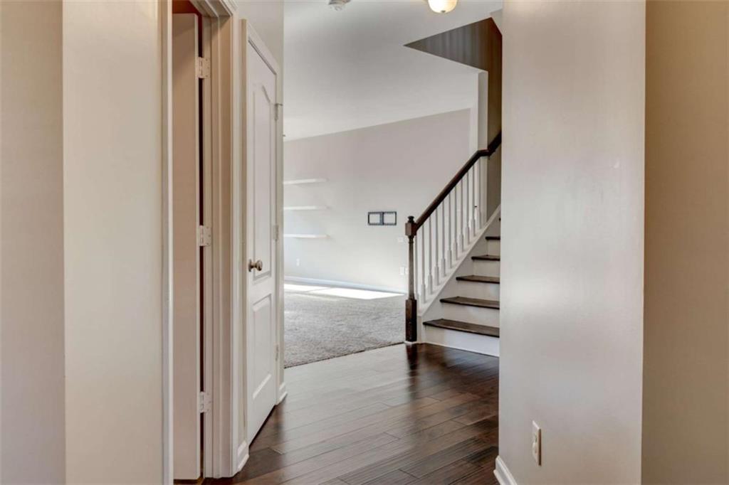 7601 Summer Berry Lane Lithonia, GA 30038 - Photo 5 of 34 a view of hallway with stairs and wooden floor