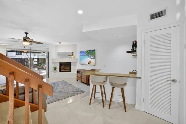 a living room with furniture and white walls